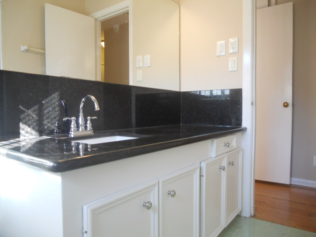 4709 Sanford Road Houston, TX 77035 - Photo 12 of 19 Lots of counter space and storage in the bathroom. The bathroom features an updated granite counter, sink, faucet, lighting and walk-in shower. (photo-2018)