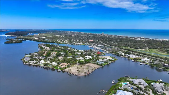 an aerial view of a house with a lake view