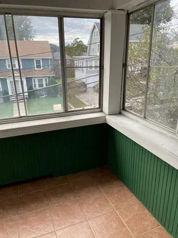 a wooden fence with yard in back