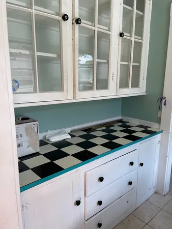 a kitchen with a cabinets and a stove