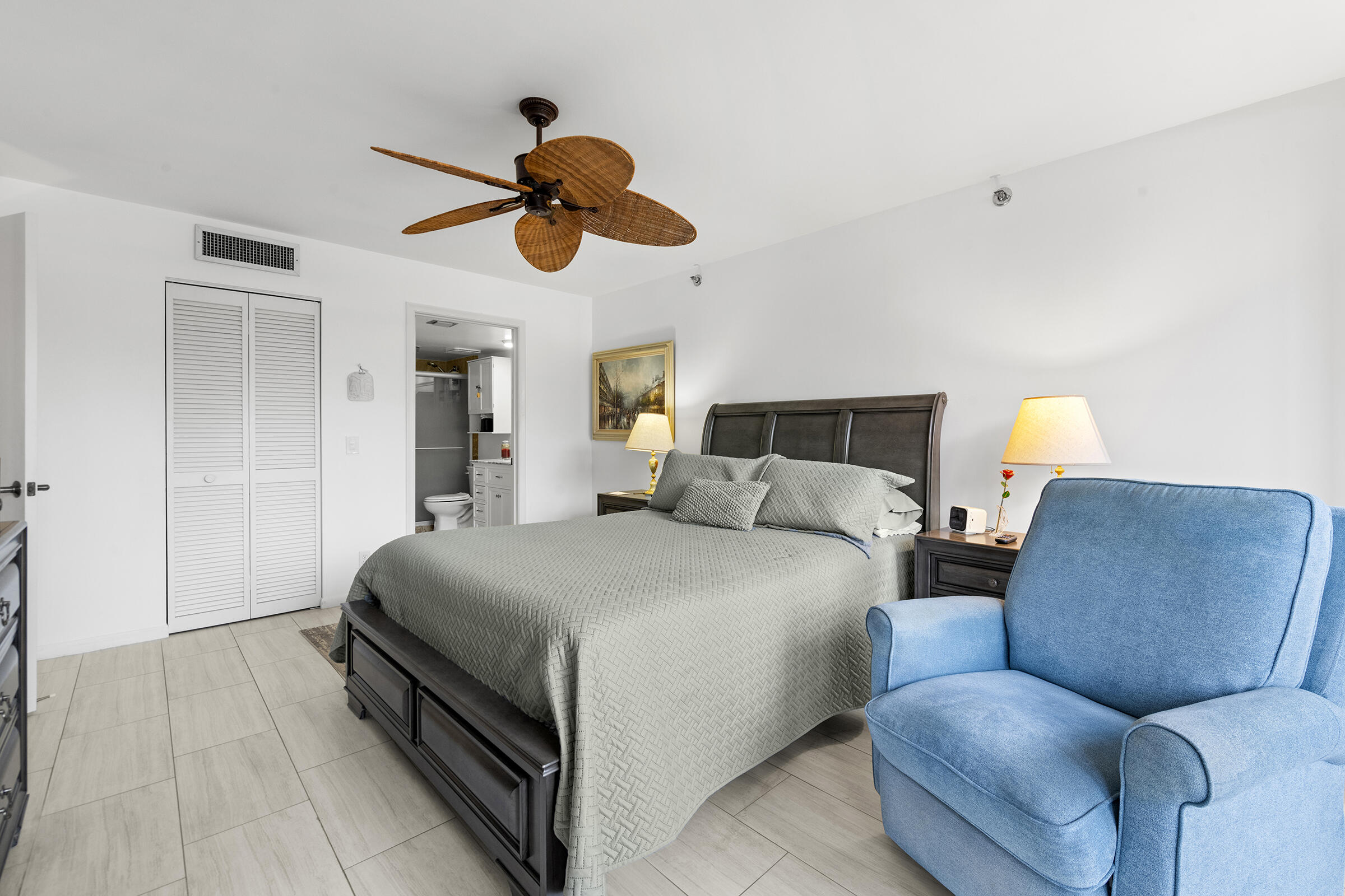 6845 Willow Wood Drive, Unit 3012 Boca Raton, FL 33434 - Photo 12 of 28 a bedroom with a bed and ceiling fan