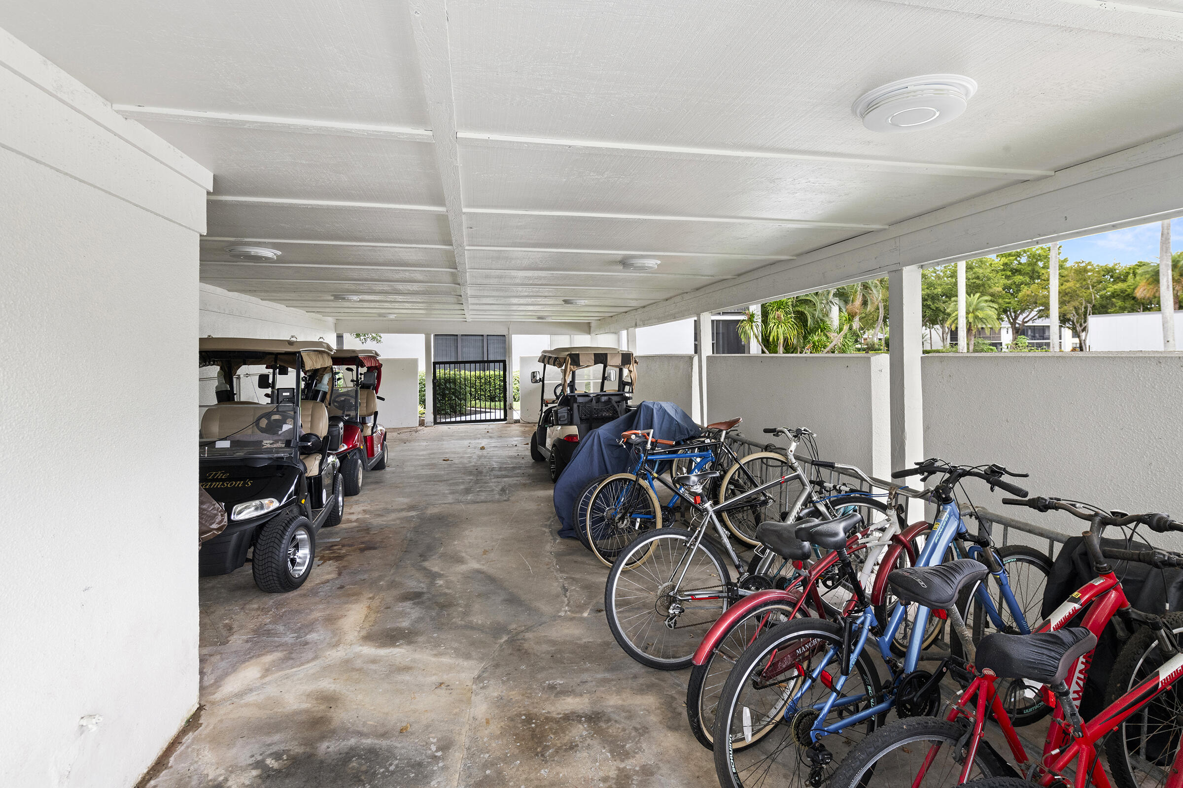 6845 Willow Wood Drive, Unit 3012 Boca Raton, FL 33434 - Photo 23 of 28 a view of a bike storage with bicycles