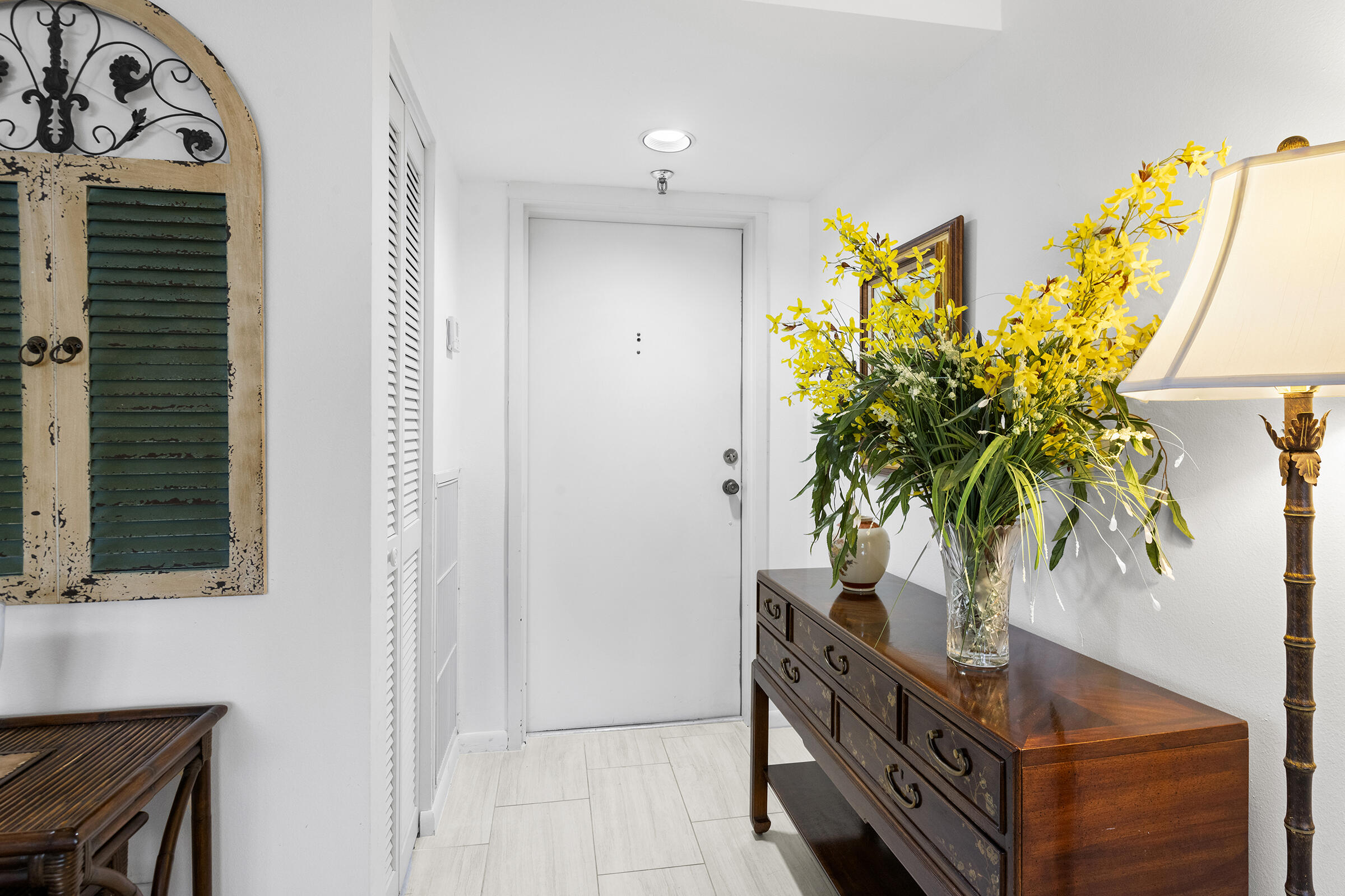 6845 Willow Wood Drive, Unit 3012 Boca Raton, FL 33434 - Photo 3 of 28 a potted plant sitting in front of a door
