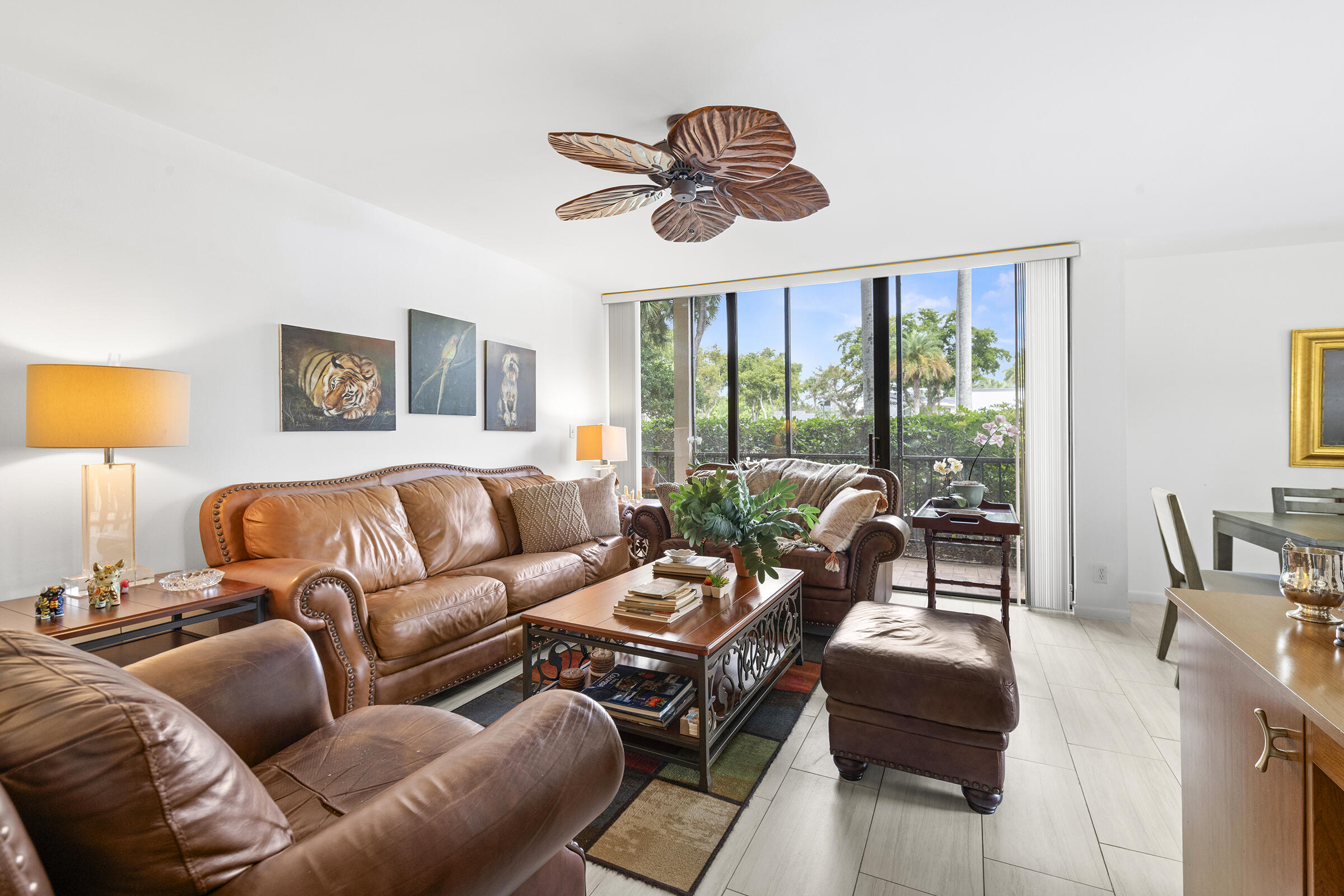 6845 Willow Wood Drive, Unit 3012 Boca Raton, FL 33434 - Photo 5 of 28 a living room with furniture and a large window