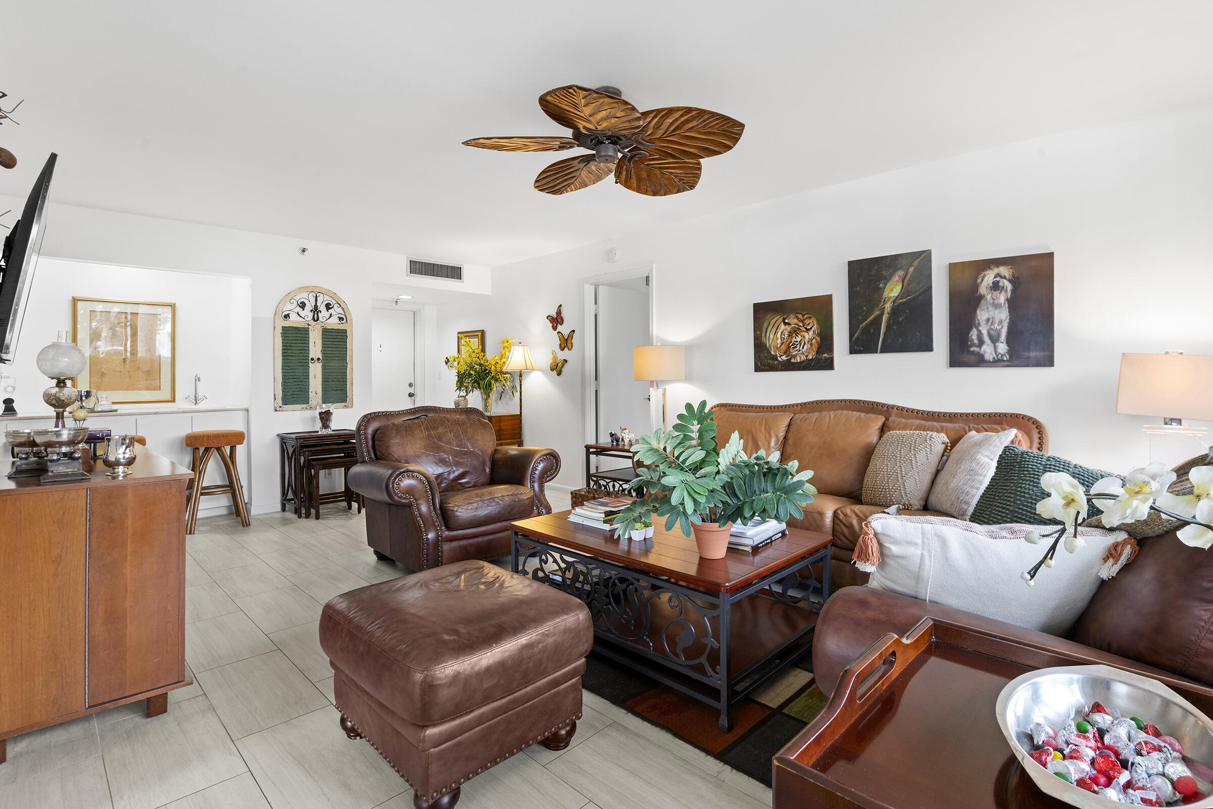 6845 Willow Wood Drive, Unit 3012 Boca Raton, FL 33434 - Photo 7 of 28 a living room with furniture potted plant and a window