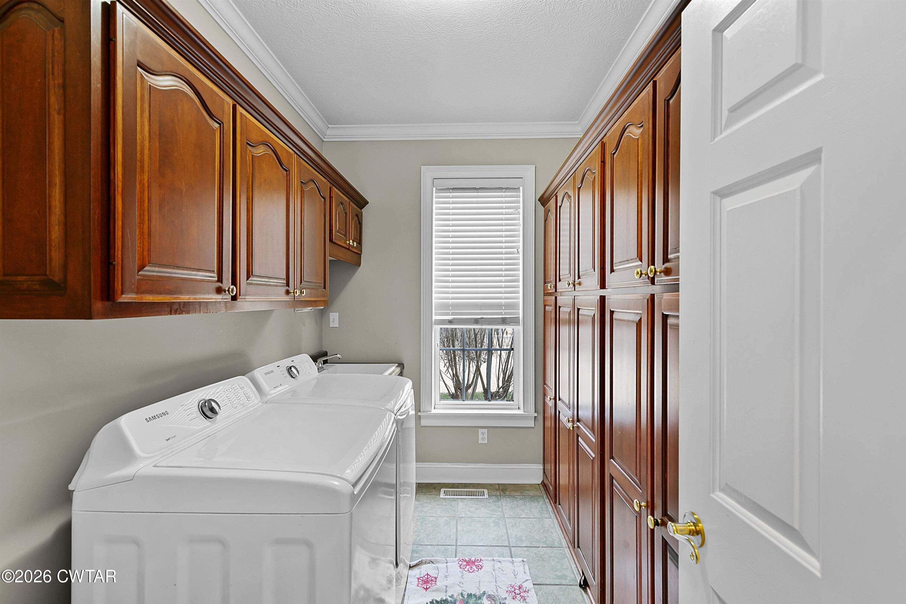 255 Oak Ridge Drive Henderson, TN 38340 - Photo 12 of 23 a utility room with dryer and washer