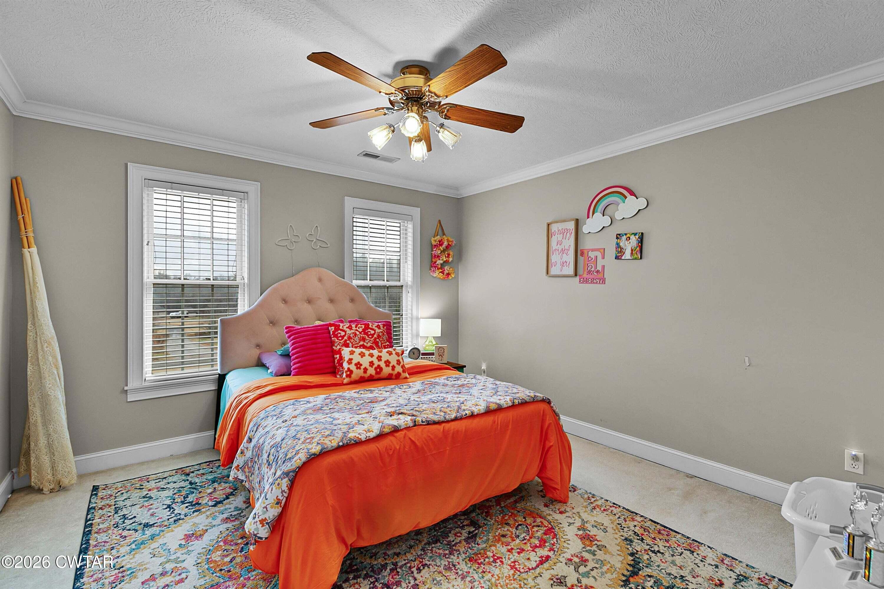 255 Oak Ridge Drive Henderson, TN 38340 - Photo 17 of 23 a bedroom with a bed and a window