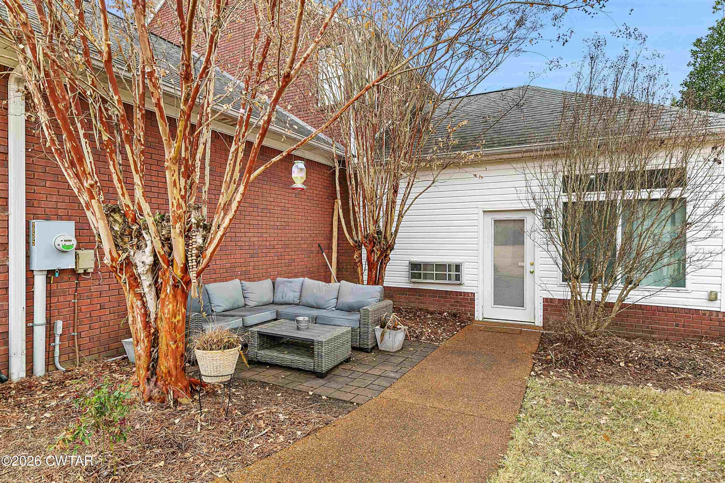 255 Oak Ridge Drive Henderson, TN 38340 - Photo 4 of 23 a view of a backyard with couches and a fire pit