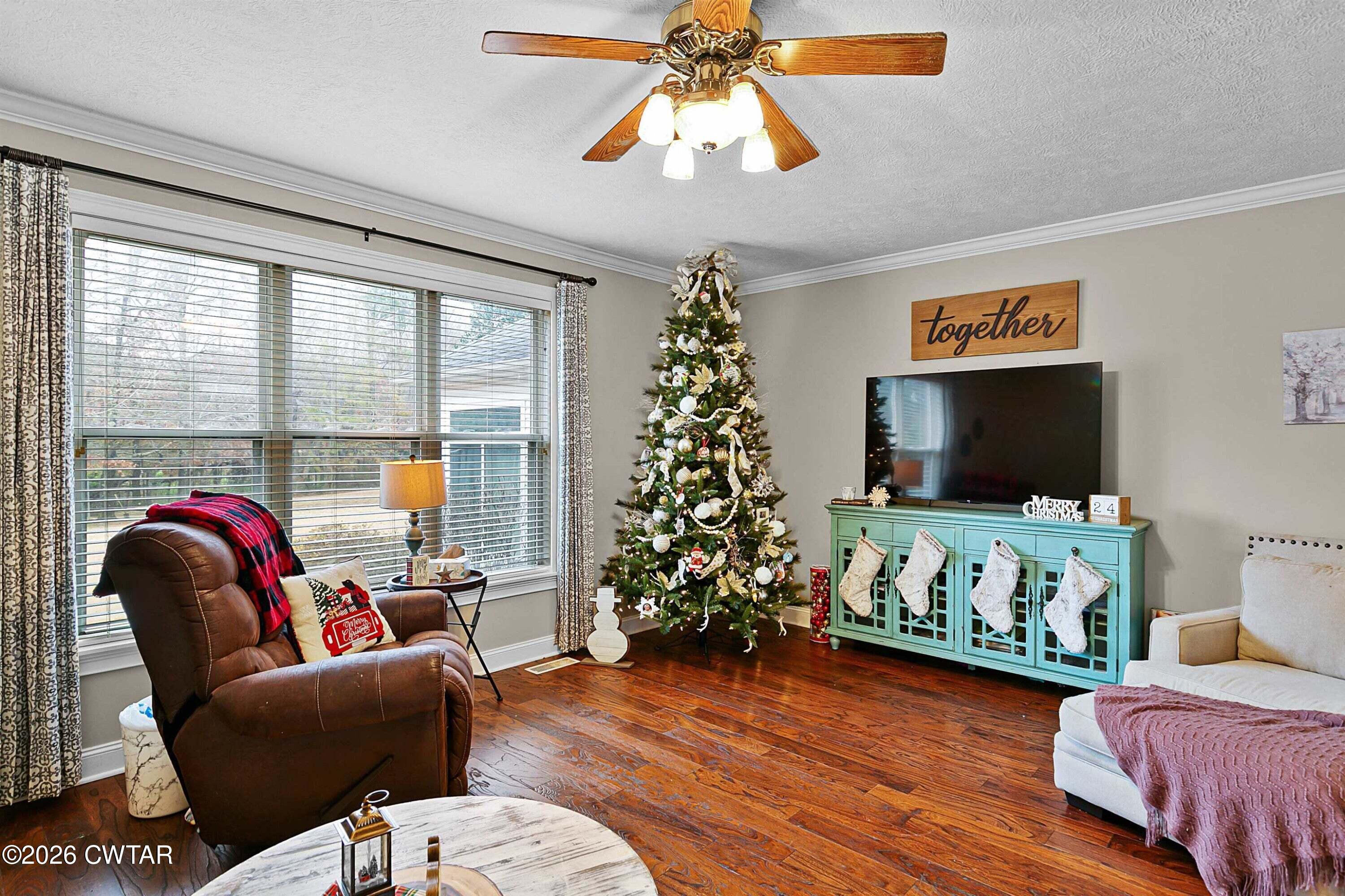 255 Oak Ridge Drive Henderson, TN 38340 - Photo 7 of 23 a living room with furniture and a flat screen tv
