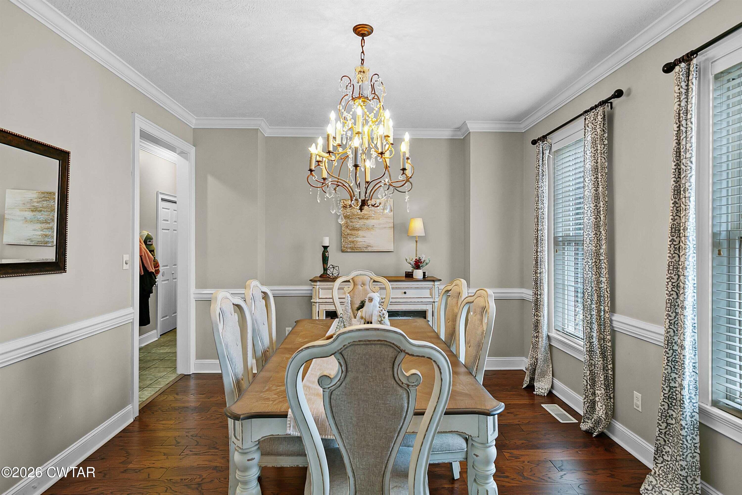 255 Oak Ridge Drive Henderson, TN 38340 - Photo 8 of 23 a view of a dining room with furniture window and wooden floor