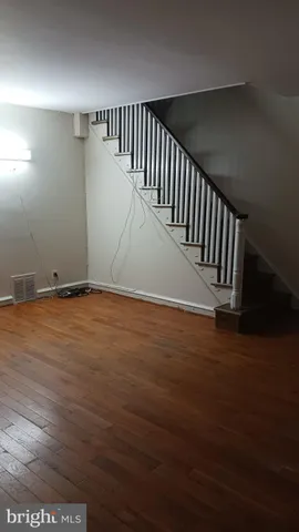a view of wooden floor and stairs in a room