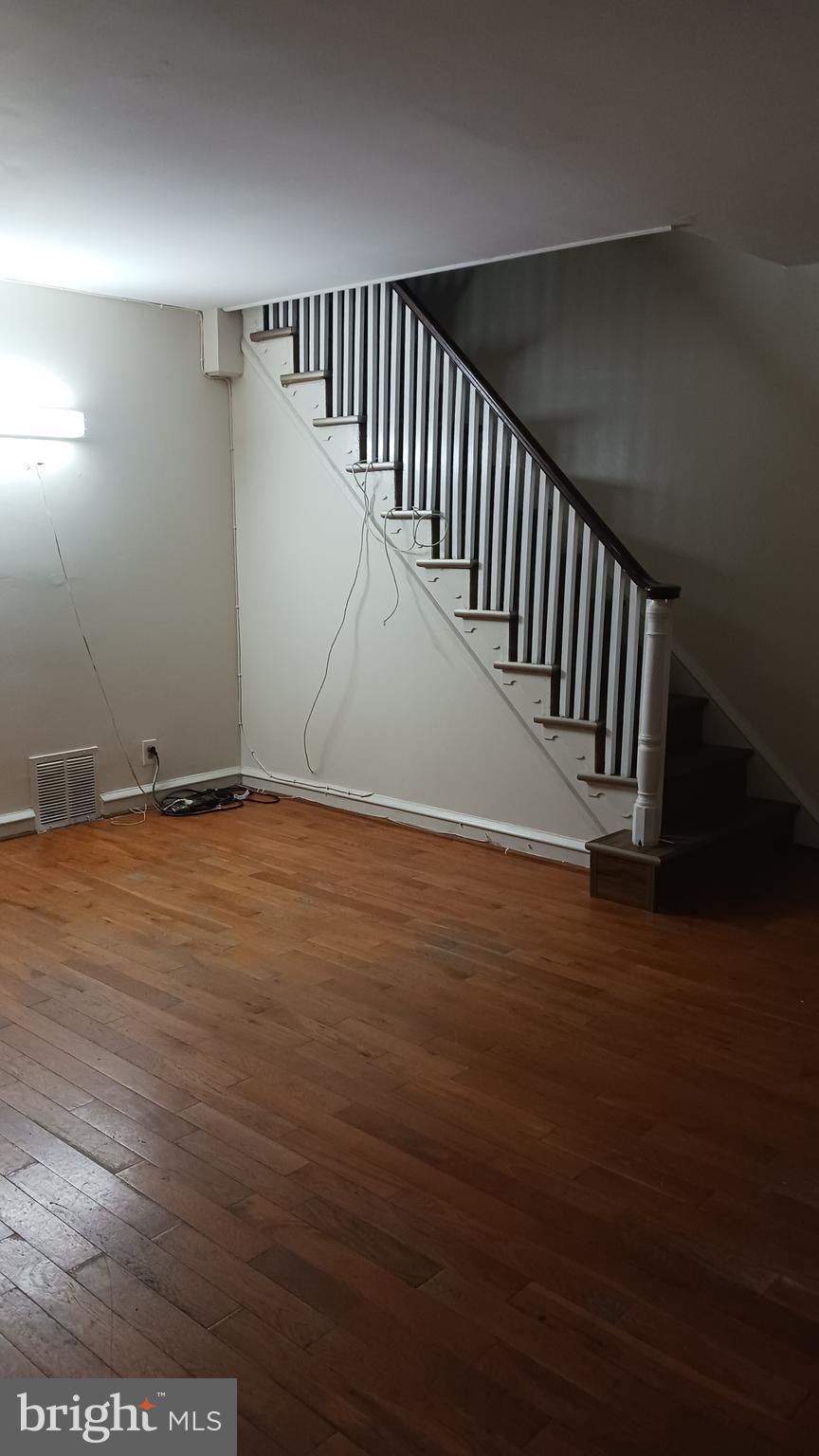 7239 Hanford Street Philadelphia, PA 19149 - Photo 14 of 16 a view of an empty room with wooden floor