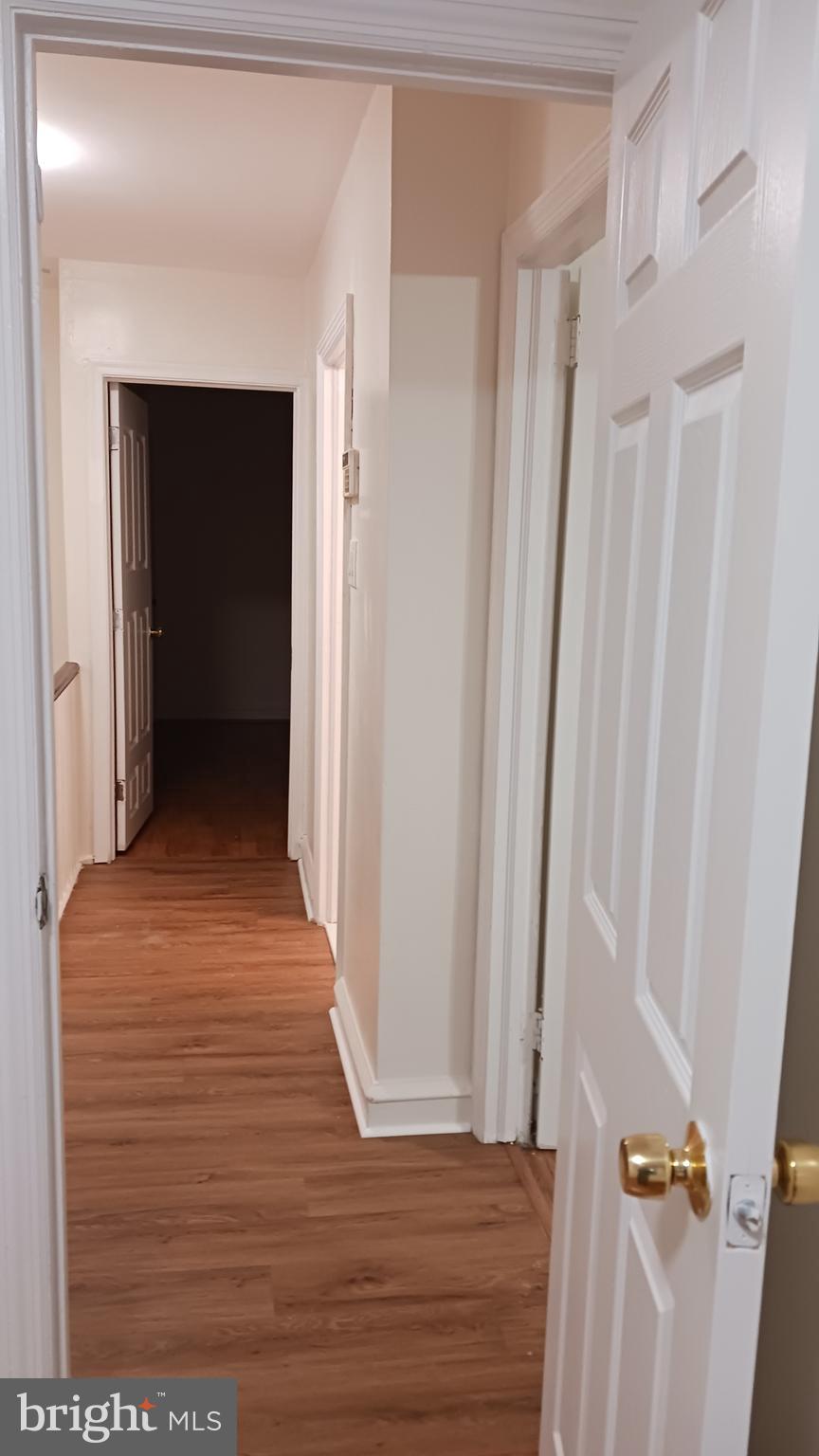 7239 Hanford Street Philadelphia, PA 19149 - Photo 6 of 16 a view of a hallway with wooden floor