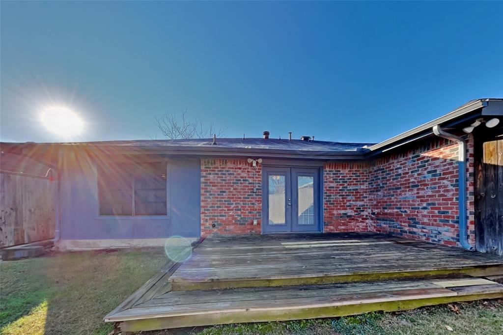 5217 Hollow Bend Lane Garland, TX 75043 - Photo 17 of 18 a front view of a house with garden