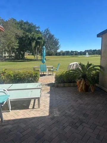 a living room with furniture gym equipment and a window