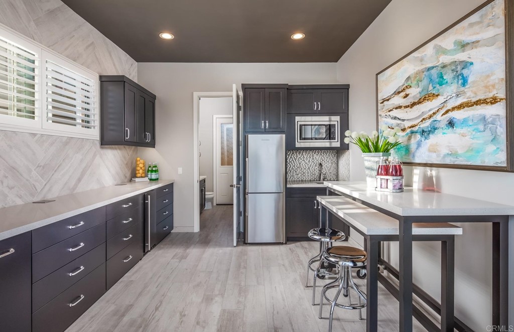 937 Pearl Drive San Marcos, CA 92078 - Photo 16 of 54 a kitchen with stainless steel appliances granite countertop a refrigerator and a stove top oven