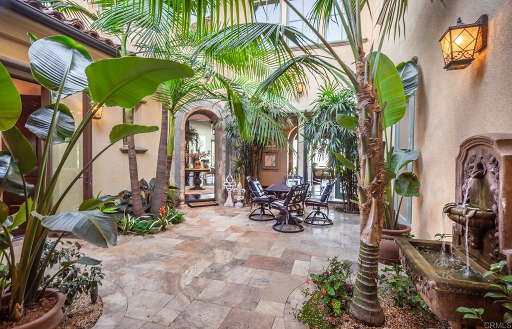 937 Pearl Drive San Marcos, CA 92078 - Photo 24 of 54 a couple of table and chairs in the patio in front of a house