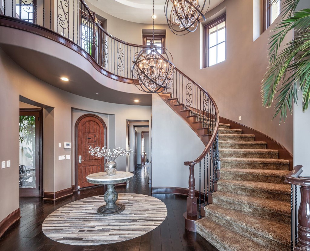 937 Pearl Drive San Marcos, CA 92078 - Photo 26 of 54 a view of a dining room with furniture a chandelier and wooden floor