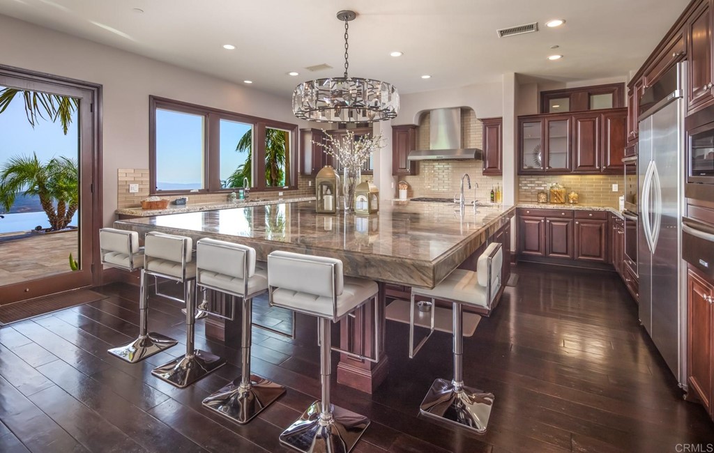 937 Pearl Drive San Marcos, CA 92078 - Photo 31 of 54 a view of a dining room with furniture window and wooden floor