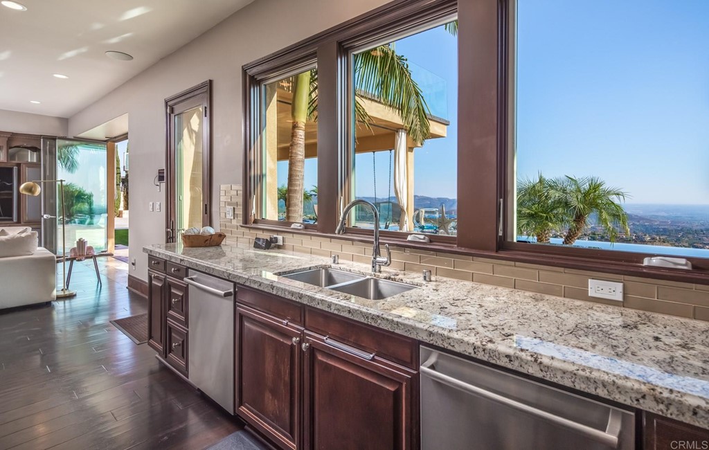 937 Pearl Drive San Marcos, CA 92078 - Photo 32 of 54 a large kitchen with kitchen island a large window in it