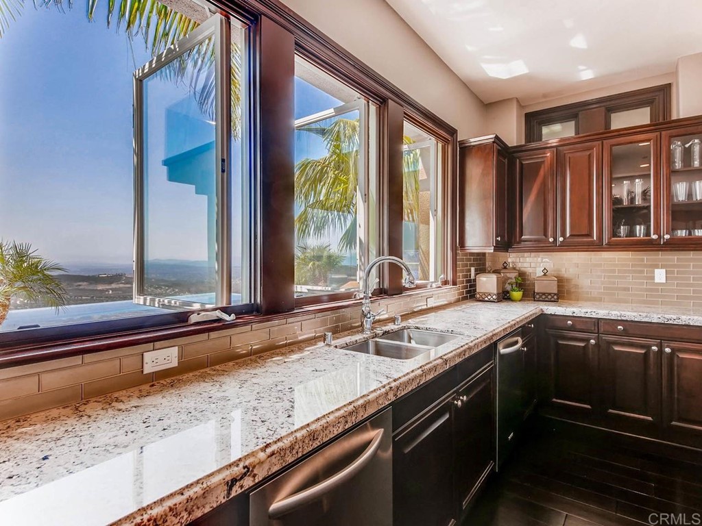 937 Pearl Drive San Marcos, CA 92078 - Photo 34 of 54 a view of a kitchen with a sink and cabinets