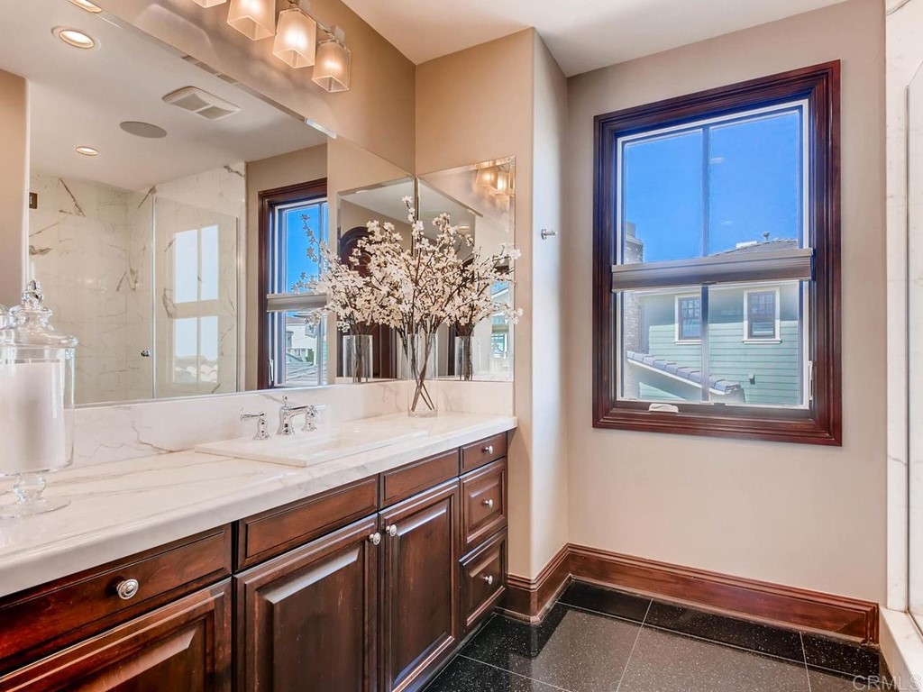 937 Pearl Drive San Marcos, CA 92078 - Photo 50 of 54 a bathroom with a sink a vanity and a large mirror