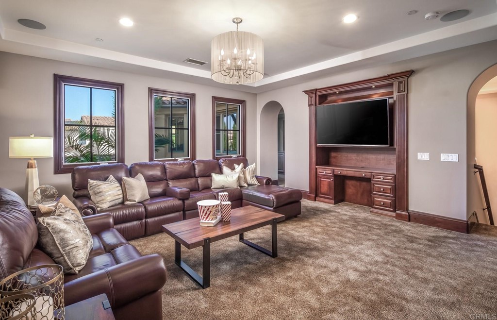 937 Pearl Drive San Marcos, CA 92078 - Photo 51 of 54 a living room with furniture a fireplace and a flat screen tv
