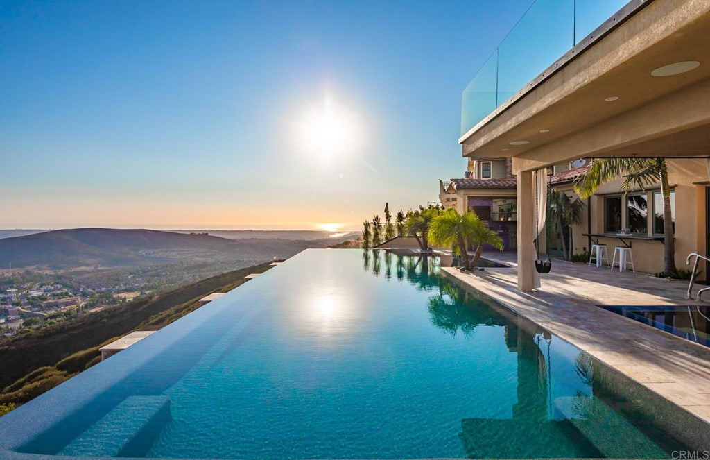 937 Pearl Drive San Marcos, CA 92078 - Photo 9 of 54 a view of a swimming pool with an ocean from a balcony