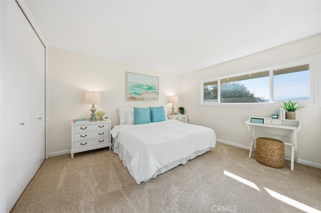 23005 Nadine Circle, Unit B Torrance, CA 90505 - Photo 12 of 29 a spacious bedroom with a bed and a window