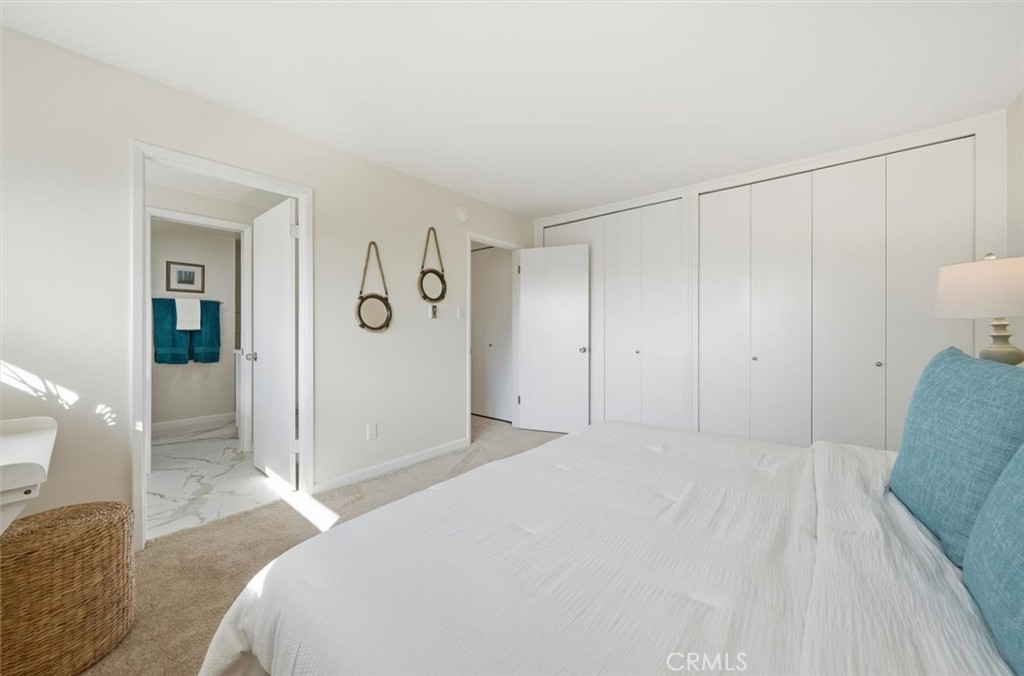 23005 Nadine Circle, Unit B Torrance, CA 90505 - Photo 15 of 29 a bedroom with a large bed and a shower
