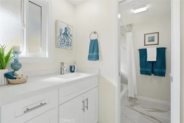 a bathroom with a sink a vanity and mirror