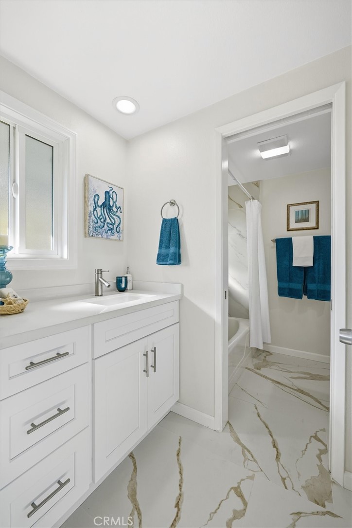 23005 Nadine Circle, Unit B Torrance, CA 90505 - Photo 17 of 29 a spacious bathroom with a sink and a mirror