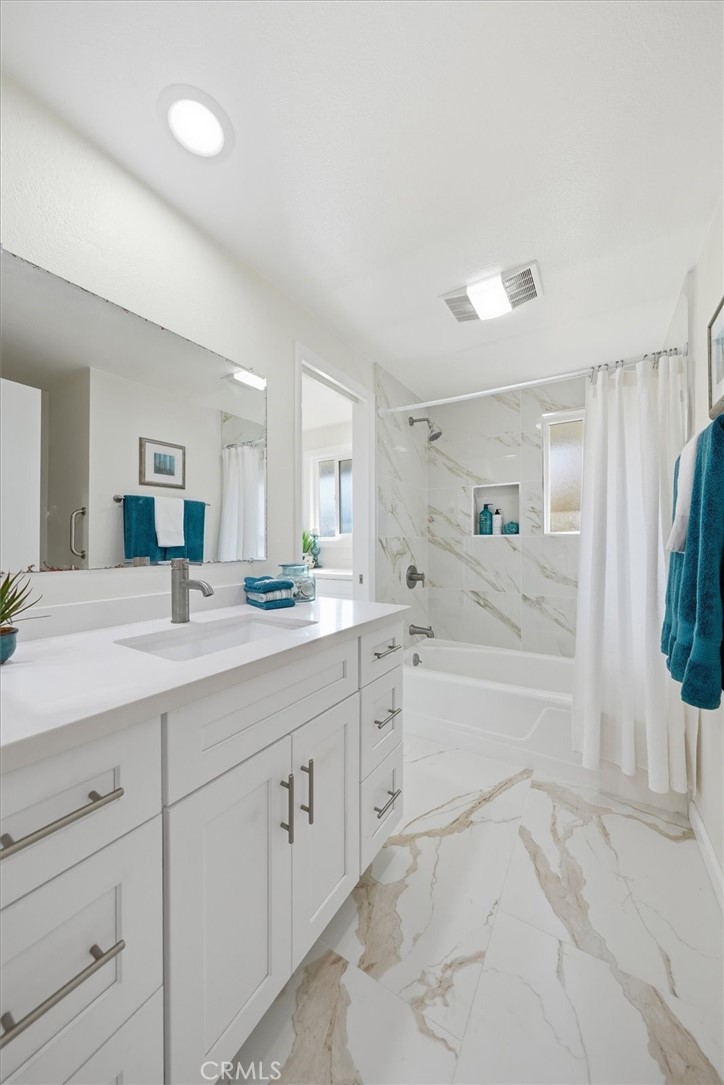 23005 Nadine Circle, Unit B Torrance, CA 90505 - Photo 18 of 29 a spacious bathroom with a granite countertop sink mirror and bathtub