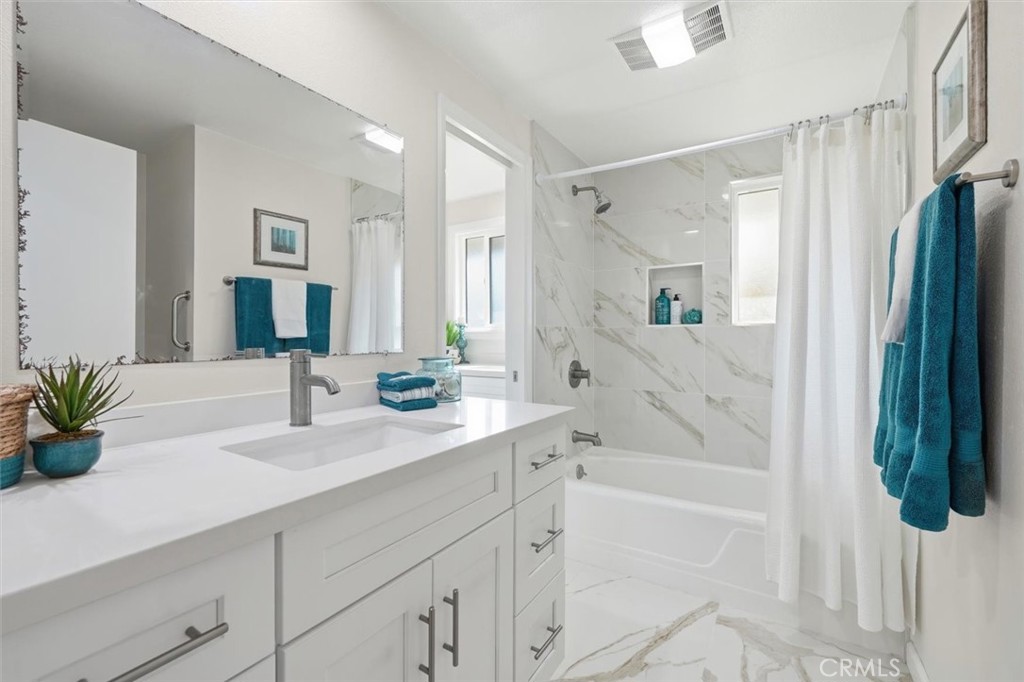 23005 Nadine Circle, Unit B Torrance, CA 90505 - Photo 19 of 29 a bathroom with a tub sink and mirror