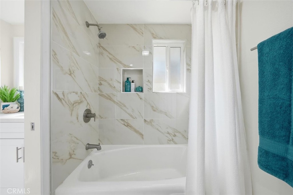 23005 Nadine Circle, Unit B Torrance, CA 90505 - Photo 20 of 29 a bathroom with a bathtub and a shower