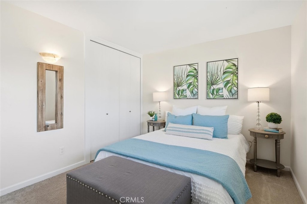 23005 Nadine Circle, Unit B Torrance, CA 90505 - Photo 22 of 29 a bedroom with a bed and a painting on the wall