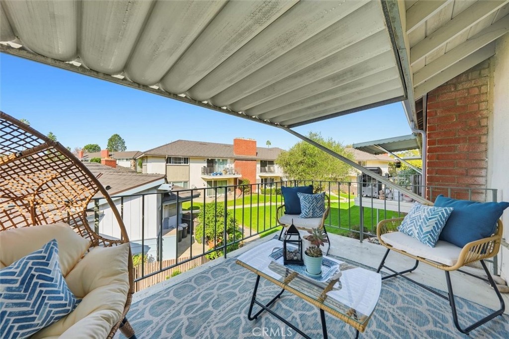 23005 Nadine Circle, Unit B Torrance, CA 90505 - Photo 24 of 29 a view of a patio with a table and chairs