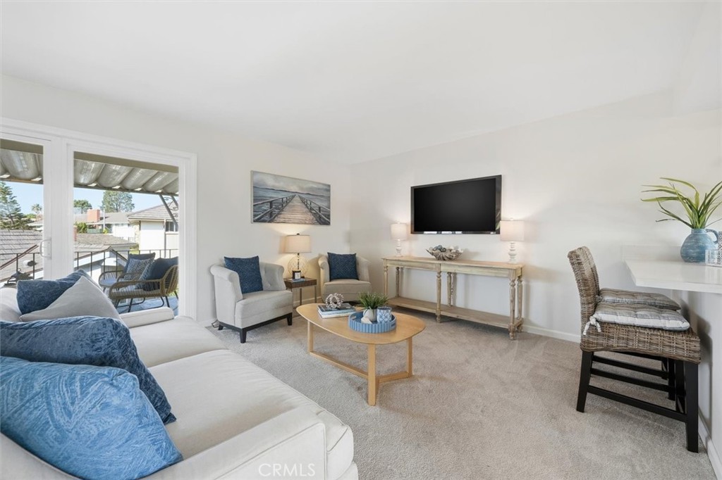 23005 Nadine Circle, Unit B Torrance, CA 90505 - Photo 3 of 29 a living room with furniture and a flat screen tv