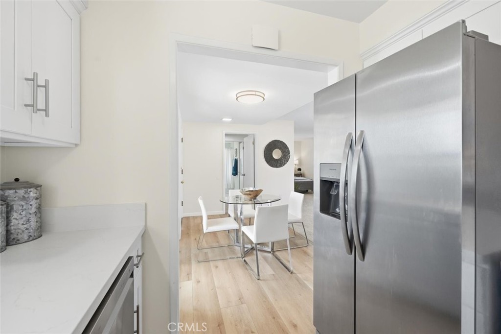 23005 Nadine Circle, Unit B Torrance, CA 90505 - Photo 9 of 29 a living room with furniture and a wooden floor