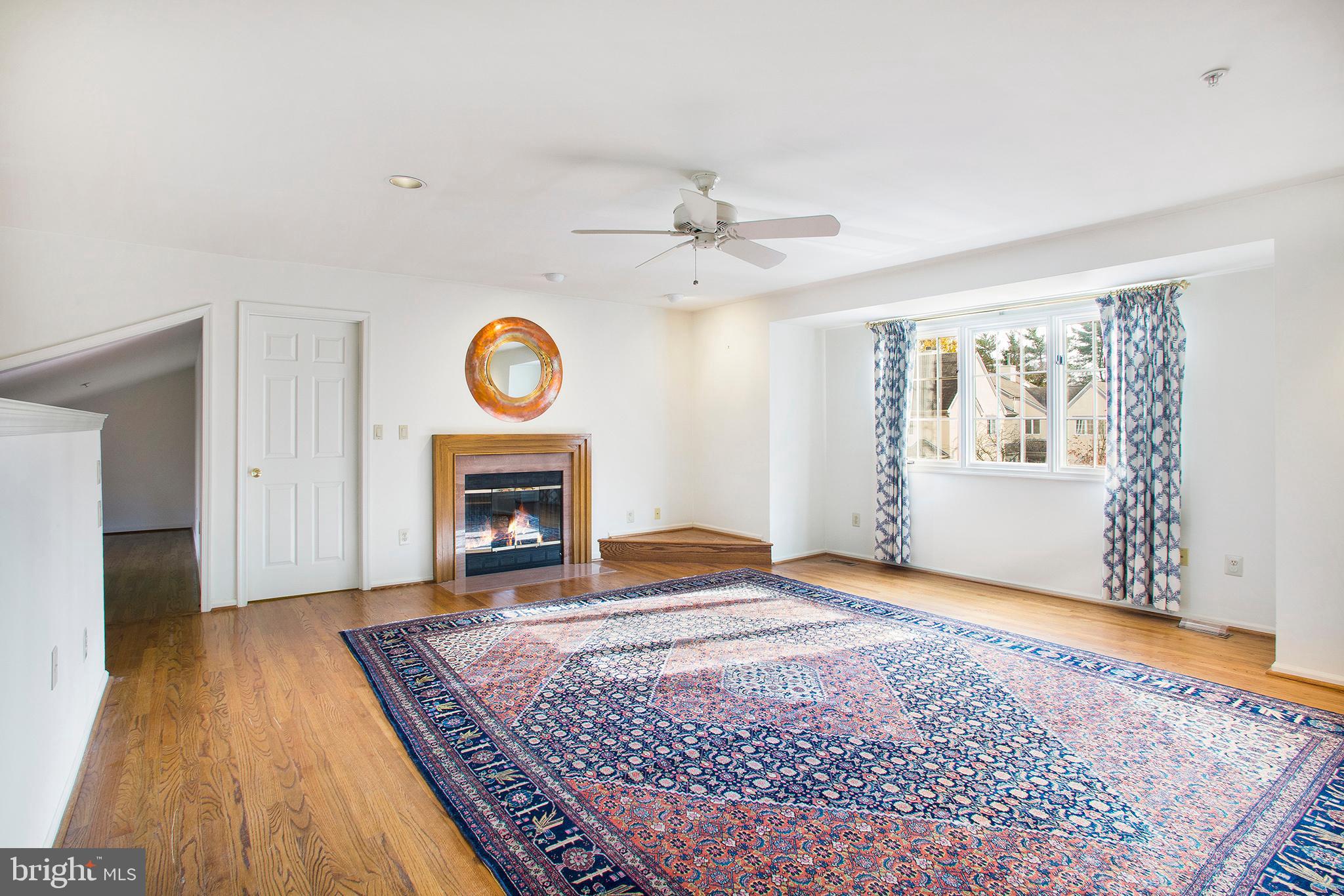 36 Clwyd Road Bala Cynwyd, PA 19004 - Photo 11 of 28 a view of an empty room with wooden floor fireplace and a window