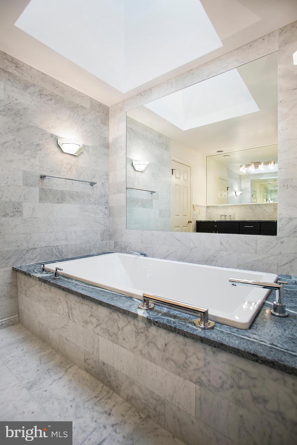 36 Clwyd Road Bala Cynwyd, PA 19004 - Photo 16 of 28 a bathroom with a granite countertop sink and a mirror