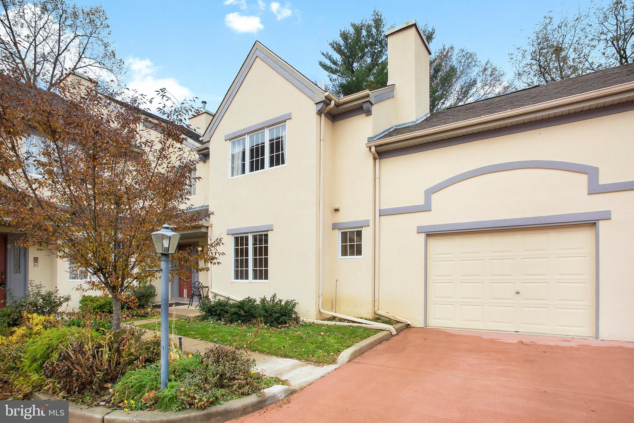 36 Clwyd Road Bala Cynwyd, PA 19004 - Photo 26 of 28 a view of a white house with a large windows and flower plants