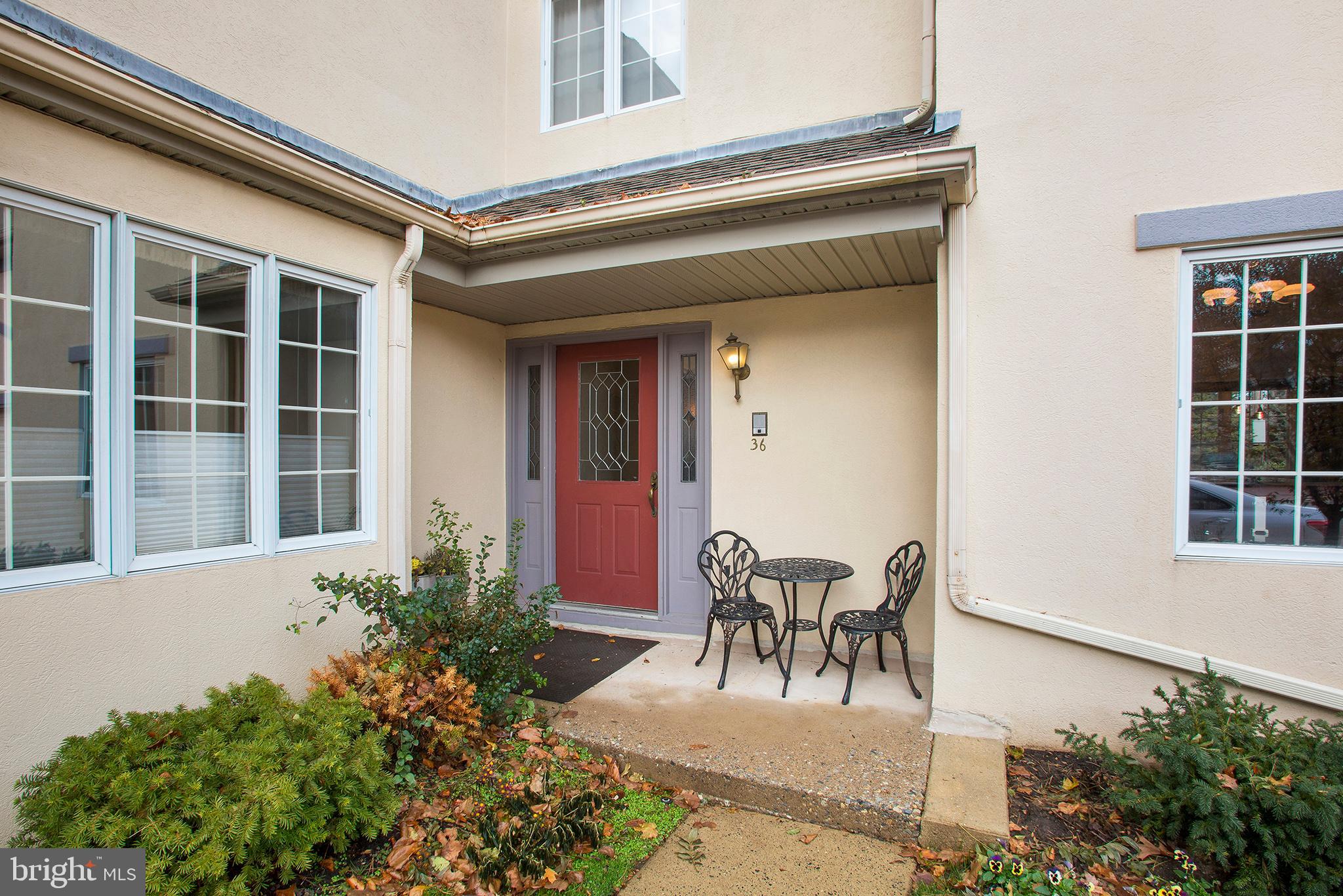 36 Clwyd Road Bala Cynwyd, PA 19004 - Photo 27 of 28 a front view of a house with outdoor seating and plants
