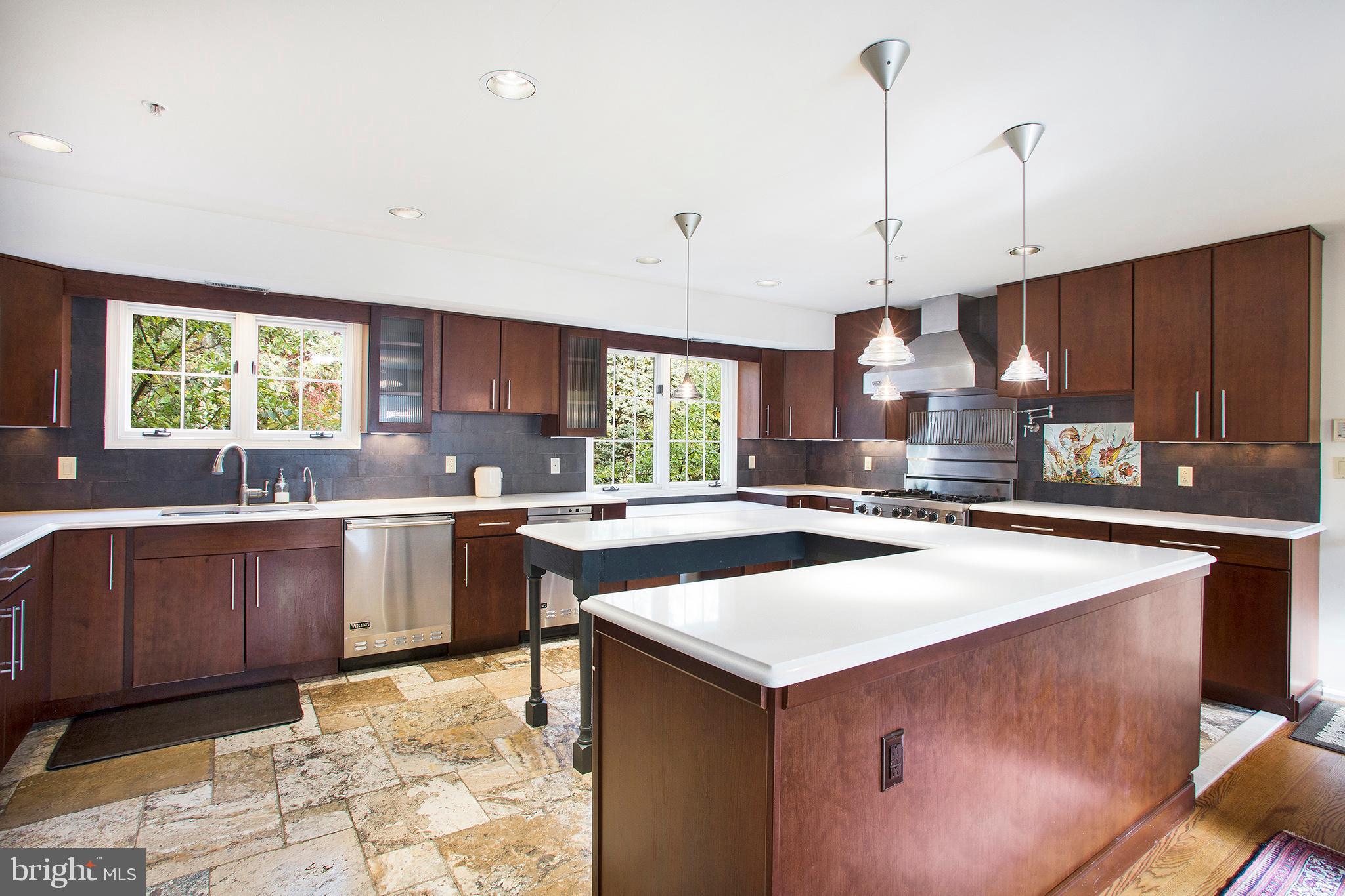 36 Clwyd Road Bala Cynwyd, PA 19004 - Photo 7 of 28 a kitchen with a sink a stove a refrigerator and wooden cabinets