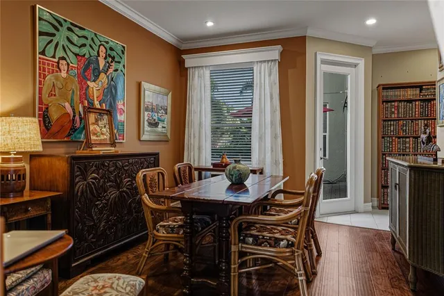 a living room with furniture and large windows