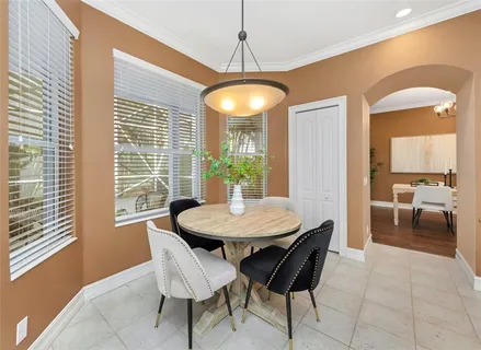 an empty room with closet and a ceiling fan