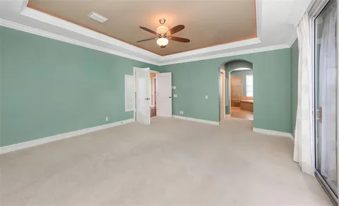 a view of a workspace with furniture and chandelier