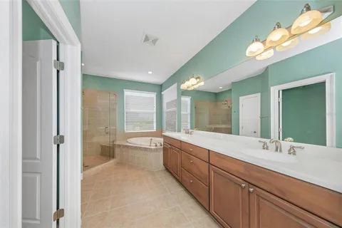 an aerial view of a house with a lake view