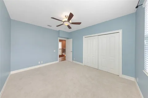 a front view of a house with a garden and a yard