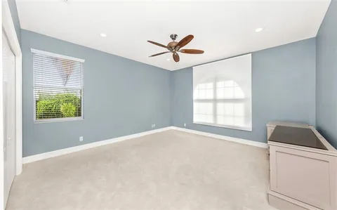 a view of a lake with a house in the background